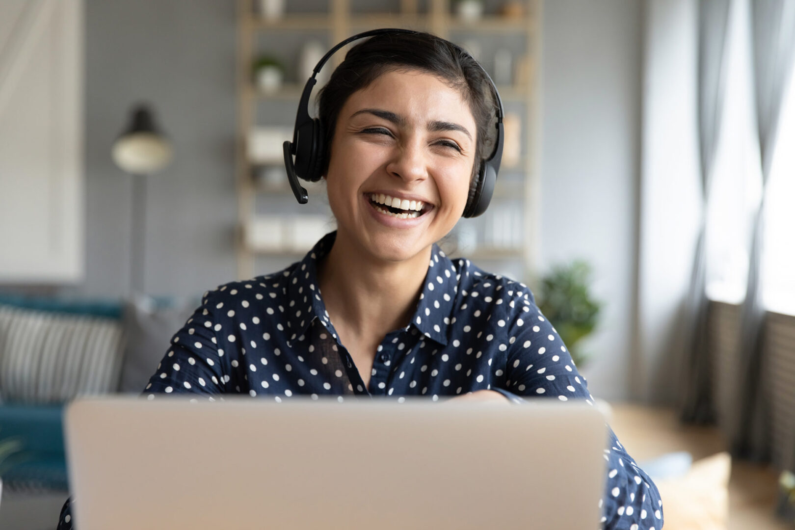 woman wearing a headset smiling 